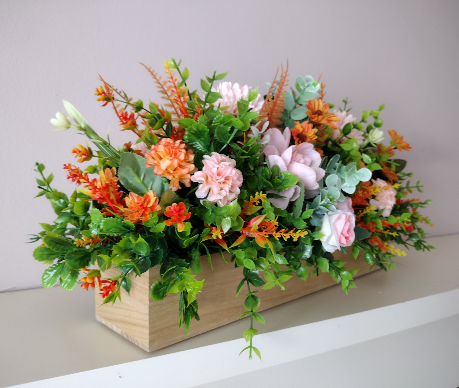 Artificial flower arrangements in a WOODEN BOXES