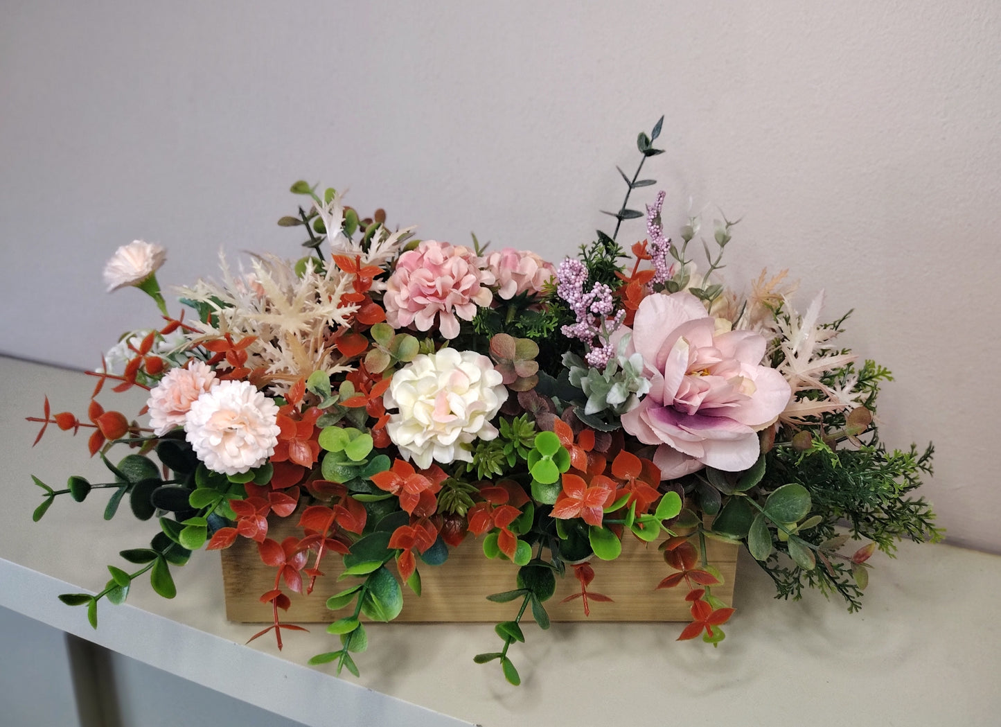 Artificial flowers in a wooden box K