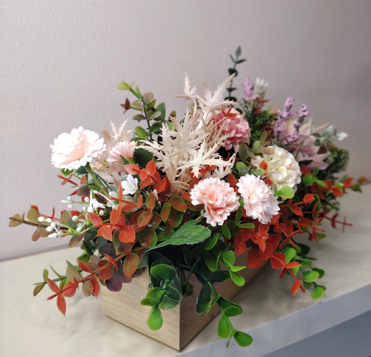 Artificial flowers in a wooden box K