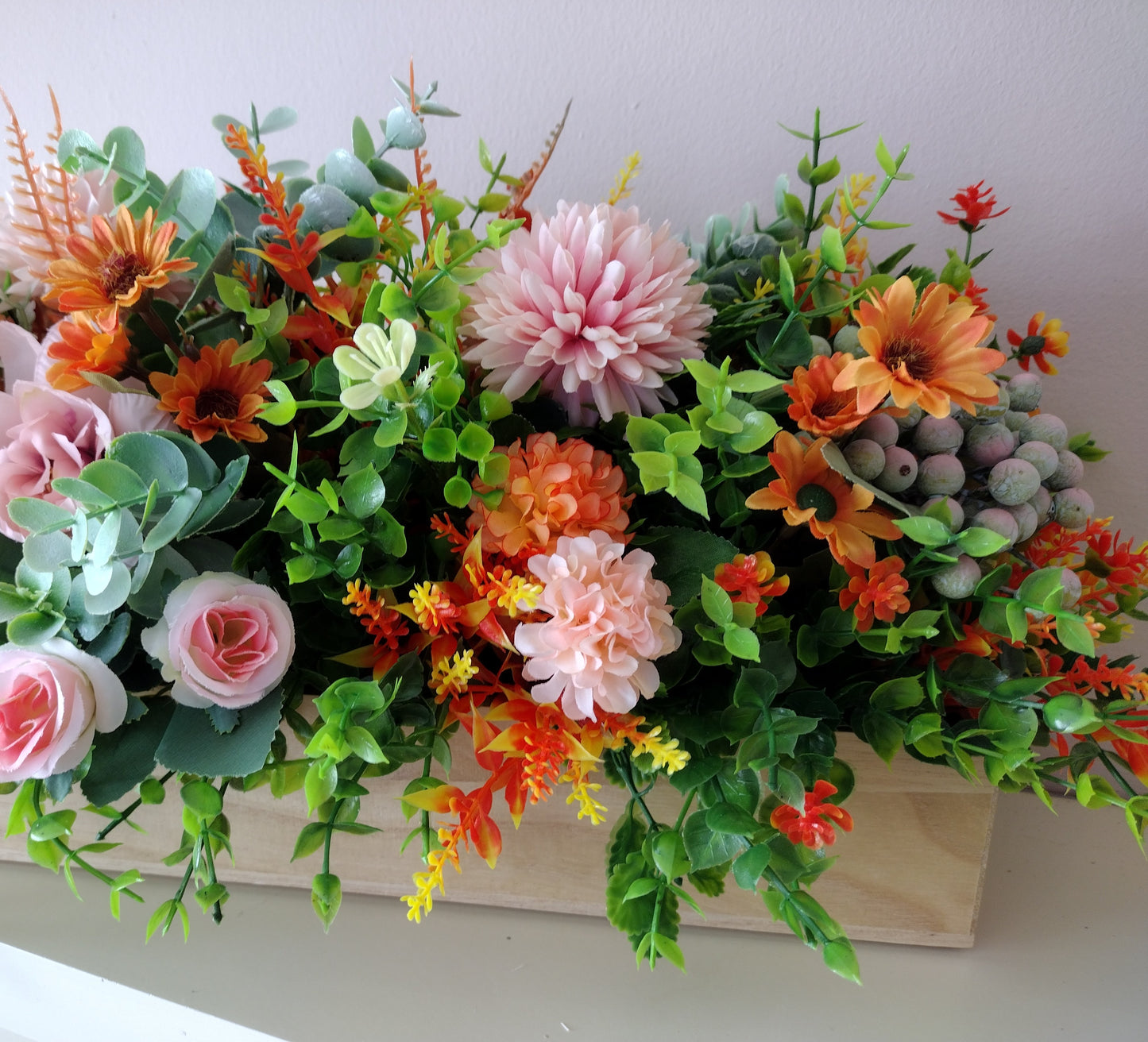 Artificial flowers in a wooden box N