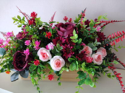 Artificial flowers in a wooden box O