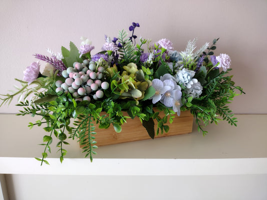 Artificial flowers in a wooden box P