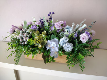 Artificial flowers in a wooden box P