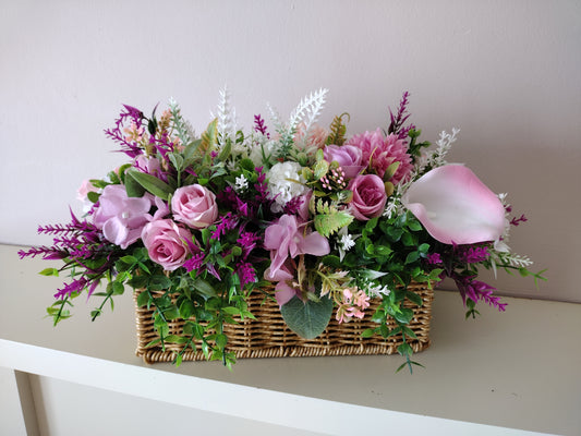 Artificial flowers in a woven basket S