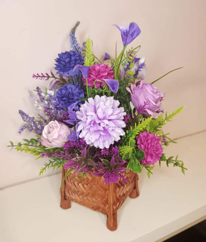 Artificial flower bouquet in a mini basket Y