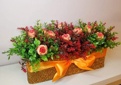 Artificial flowers in woven basket Z